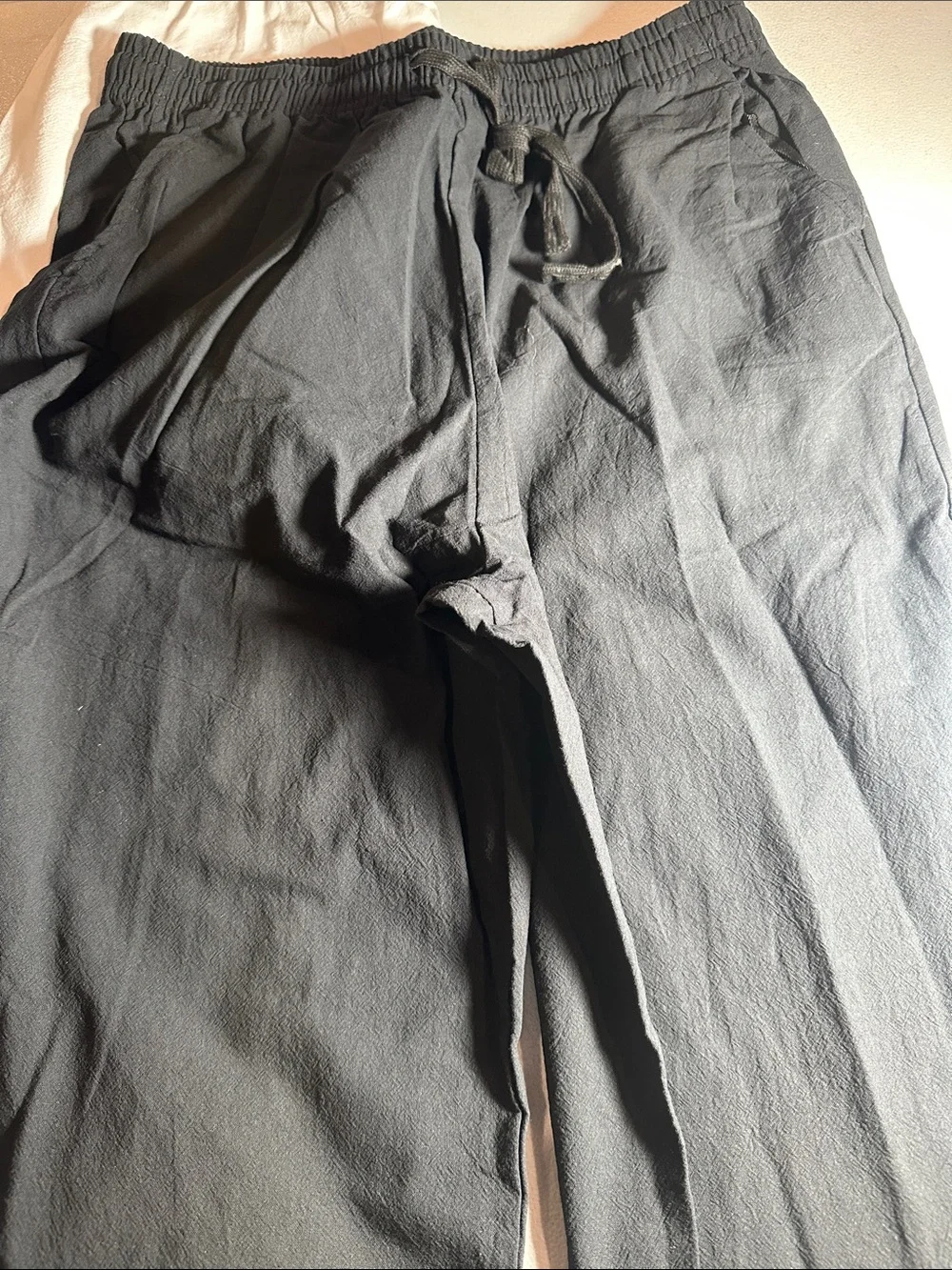 2 pack of Women's lightweight pants. One white and one black pair of medium pant